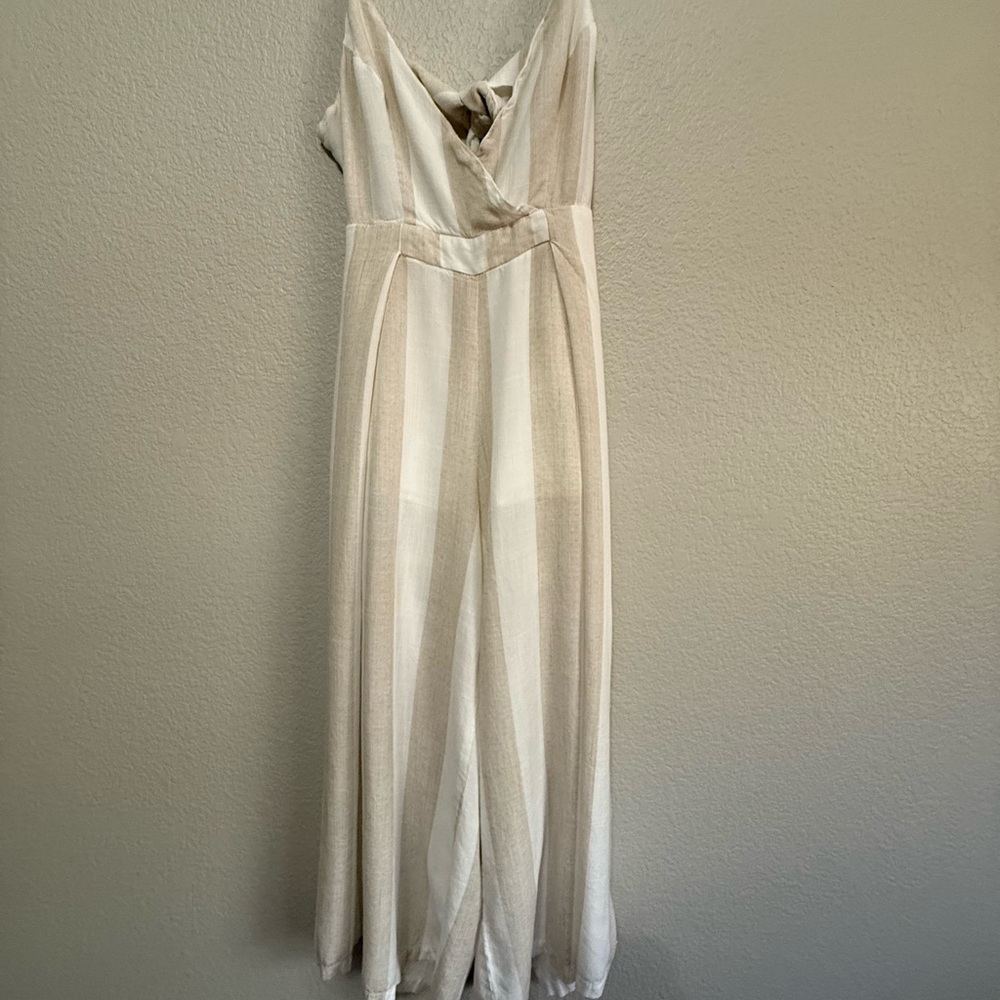 L'ATISTE Cream Wide-Leg Jumpsuit with V-Neckline